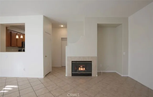 a view of an empty room with fire place