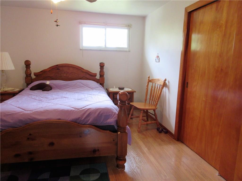 635 Fleming Road Sarver, PA 16055 - Photo 15 of 25 Bedroom three features laminate flooring, a double closet and a lighted ceiling fan.