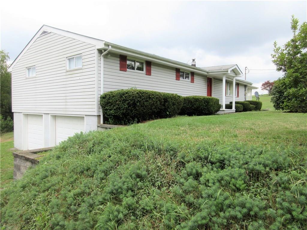 635 Fleming Road Sarver, PA 16055 - Photo 20 of 25 Side corner view of the house and 2 car integral garage.
