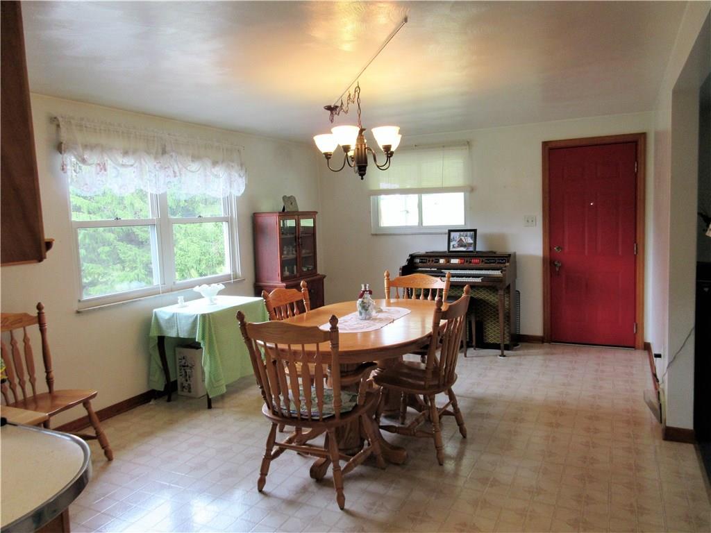 635 Fleming Road Sarver, PA 16055 - Photo 7 of 25 Great natural light and lots of space for entertaining dinner guests in this dining room, which has an entry to the covered side patio!