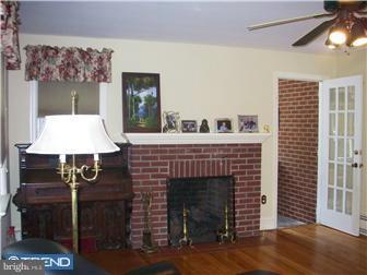 1 Grant Street Riverside, NJ 08075 - Photo 5 of 12 a view of a livingroom with furniture and a fireplace