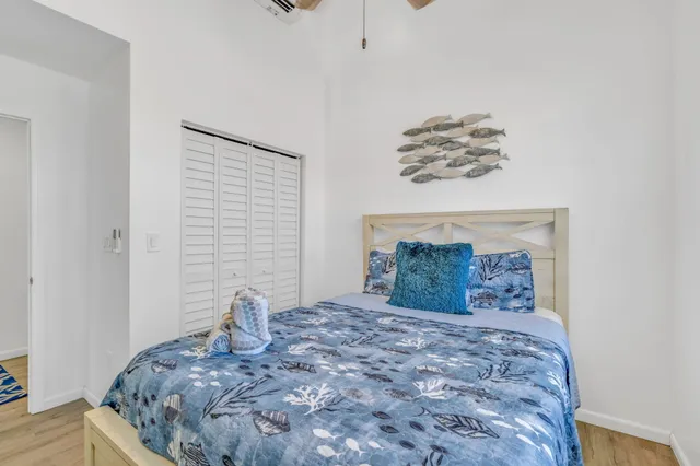 a large bed sitting in a bedroom and dresser