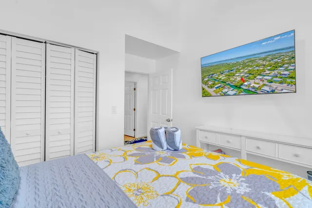 a bedroom with a bed and cupboard