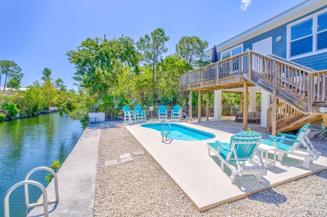a view of a swimming pool with a patio