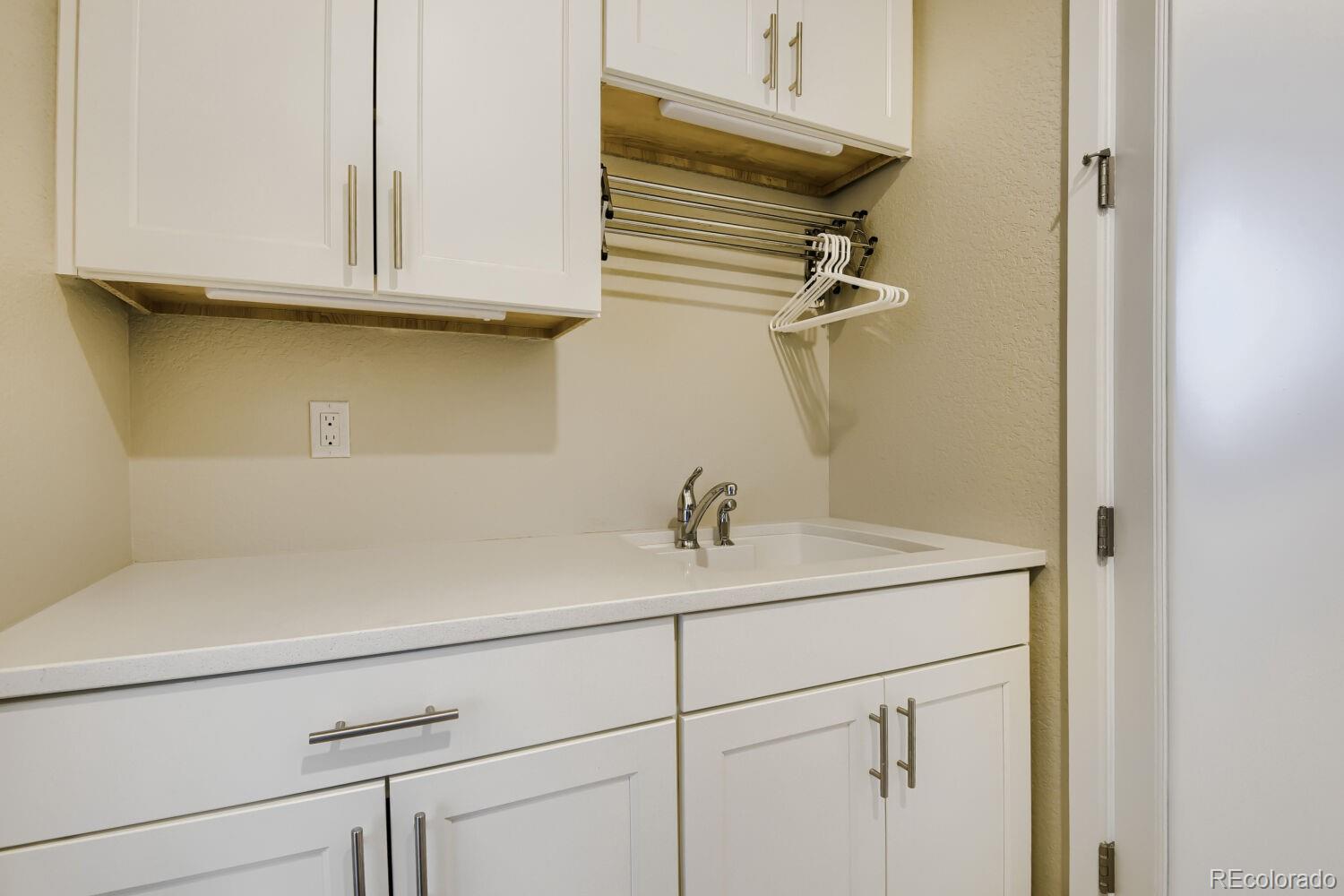 10155 Bellwether Lane Lone Tree, CO 80124 - Photo 25 of 45 a bathroom with a sink and a mirror