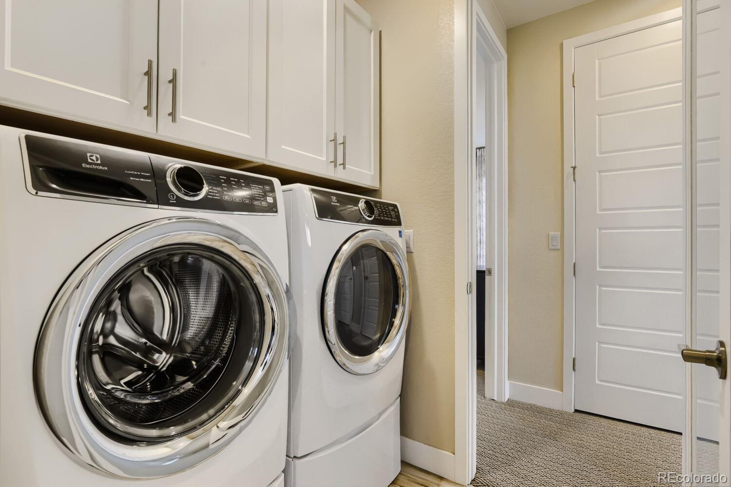 10155 Bellwether Lane Lone Tree, CO 80124 - Photo 26 of 45 a utility room with dryer and washer