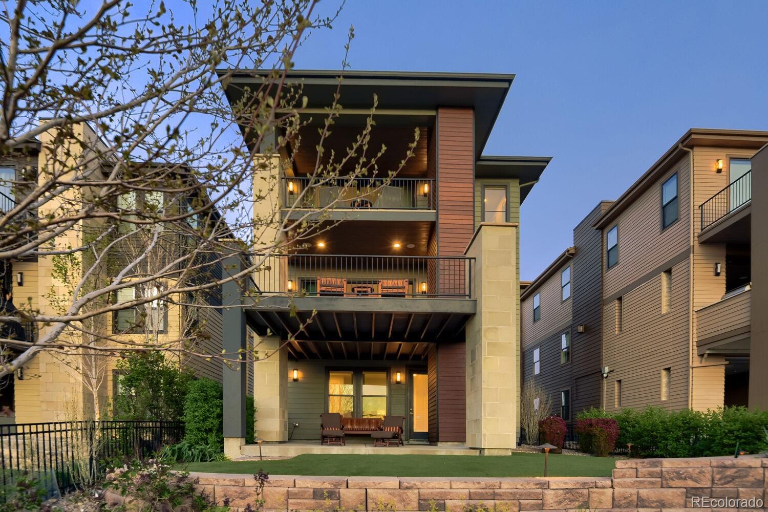 10155 Bellwether Lane Lone Tree, CO 80124 - Photo 41 of 45 a front view of a building with a garden