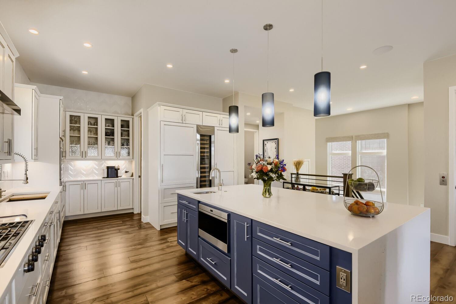 10155 Bellwether Lane Lone Tree, CO 80124 - Photo 7 of 45 a kitchen with a sink appliances and cabinets