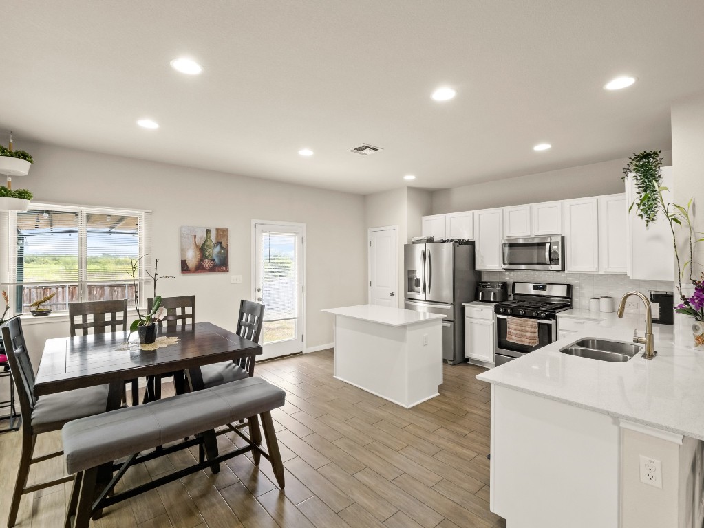 574 Nautical Loop Kyle, TX 78640 - Photo 5 of 23 a living room with stainless steel appliances furniture a dining table and kitchen view