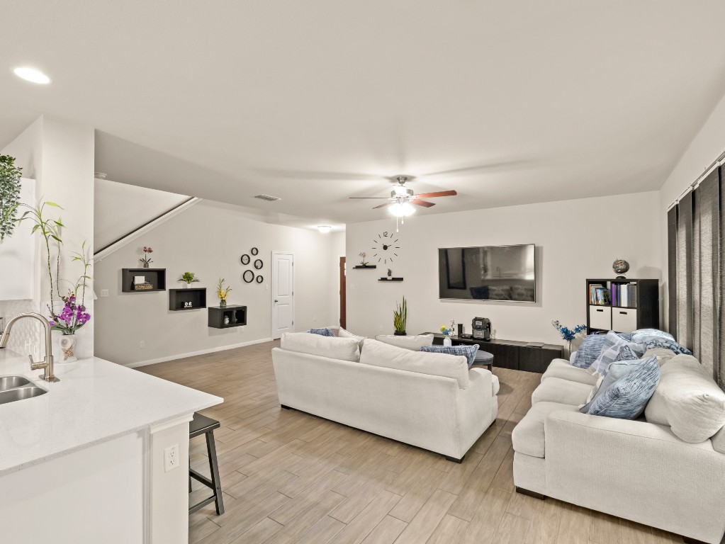 574 Nautical Loop Kyle, TX 78640 - Photo 6 of 23 a living room with furniture and a flat screen tv