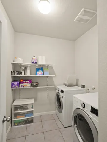a utility room with dryer and washer