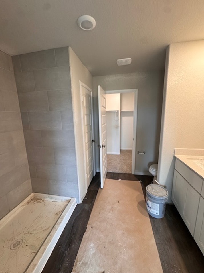 13626 Kit Run Splendora, TX 77372 - Photo 6 of 43 a bathroom with a granite countertop sink a toilet a tub and shower