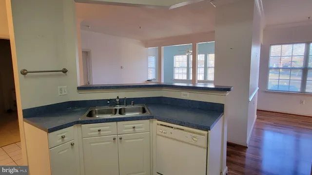 a kitchen with a sink and cabinets