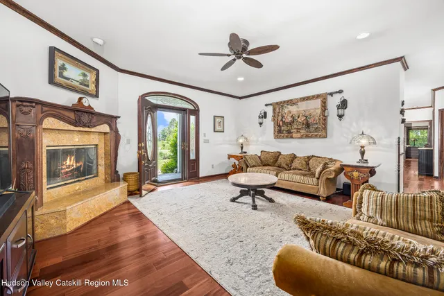 a living room with furniture and a fireplace