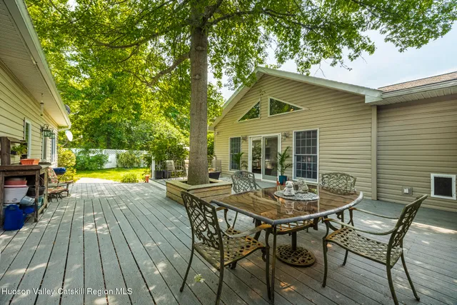 a view of house with swimming pool outdoor seating