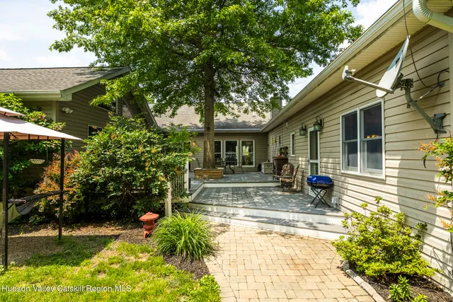 a living room with furniture flat screen tv and a fireplace