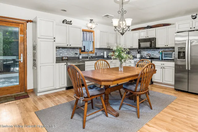 a dining room filled counter top space and a dining table