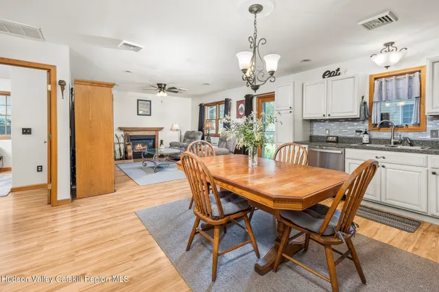 a bathroom with a sink mirror vanity and toilet