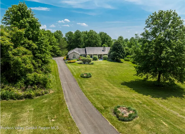 a view of a lake with houses in the back