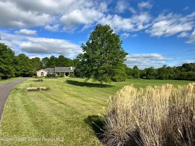 a view of a swimming pool with an outdoor space and seating area