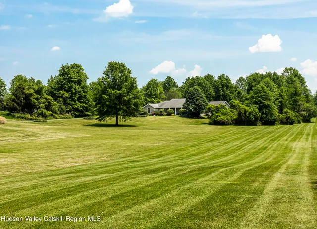 a view of a lake with a yard
