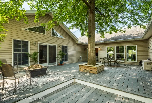 a front view of a house with sitting area