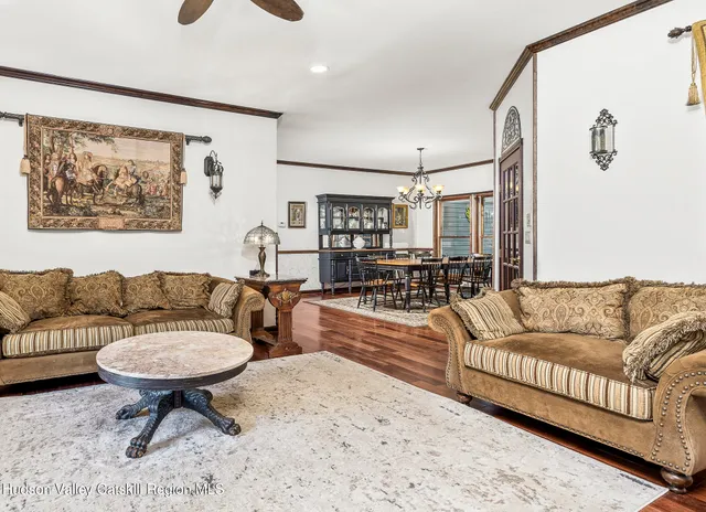 a living room with furniture and a rug