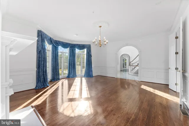 a view of an entryway with wooden floor and windows