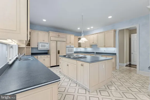 a view of an entryway with wooden floor and windows