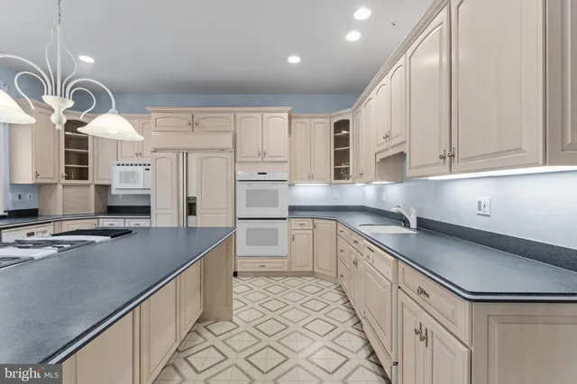 a view of a livingroom with wooden floor and a staircase