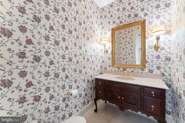 a spacious bathroom with a tub sink and mirror