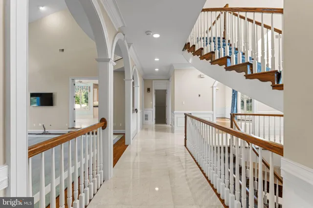 a spacious bathroom with a shower a sink and a mirror