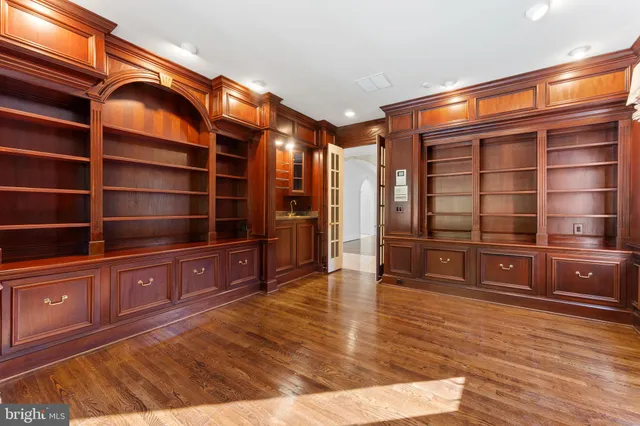 a spacious bathroom with a shower a sink and a mirror