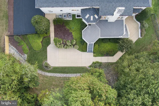 an aerial view of a house with outdoor space
