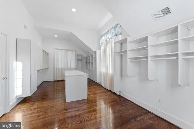 a bathroom with a sink a toilet and a shower