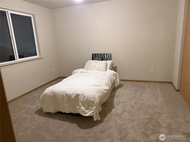 an empty room with a mirror