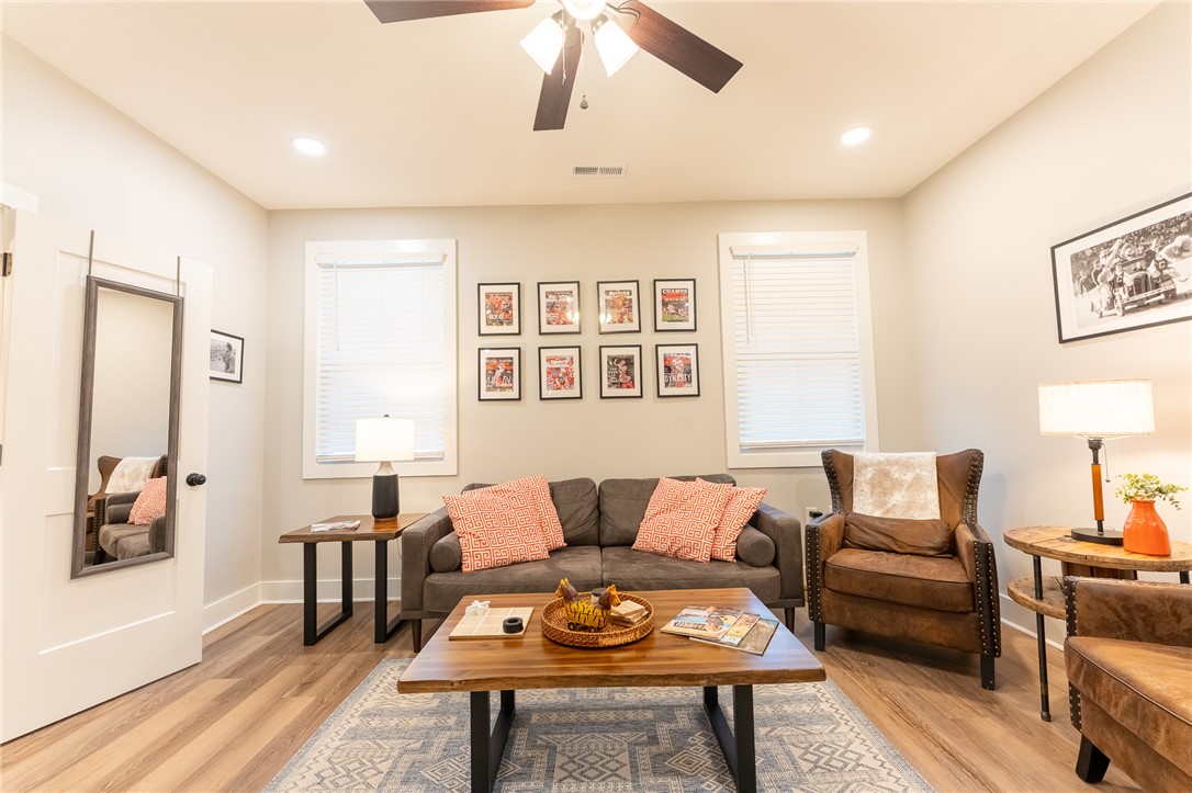 103 Riggs Drive Clemson, SC 29631 - Photo 38 of 50 Natural light illuminates this living area featuring wood flooring and recessed lighting.