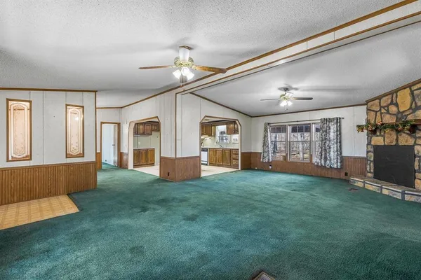 a kitchen with a refrigerator sink and cabinets