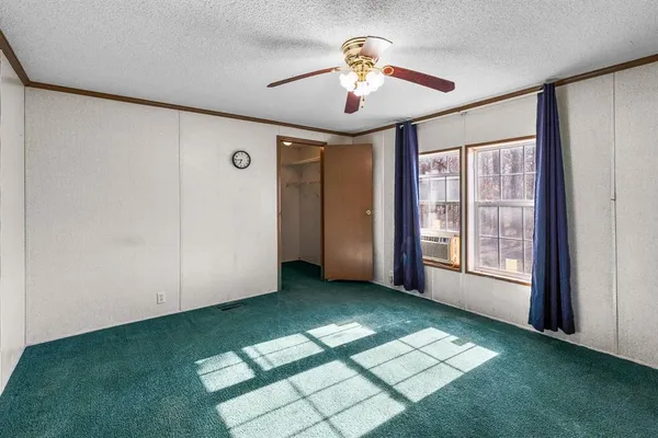 a bathroom with a shower curtain and a toilet