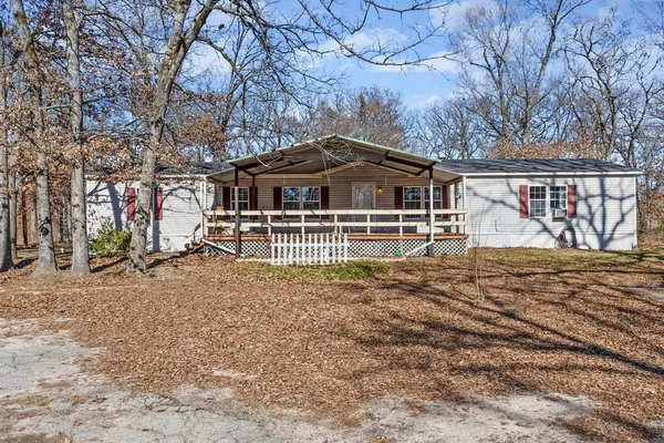 a view of a lake with a yard