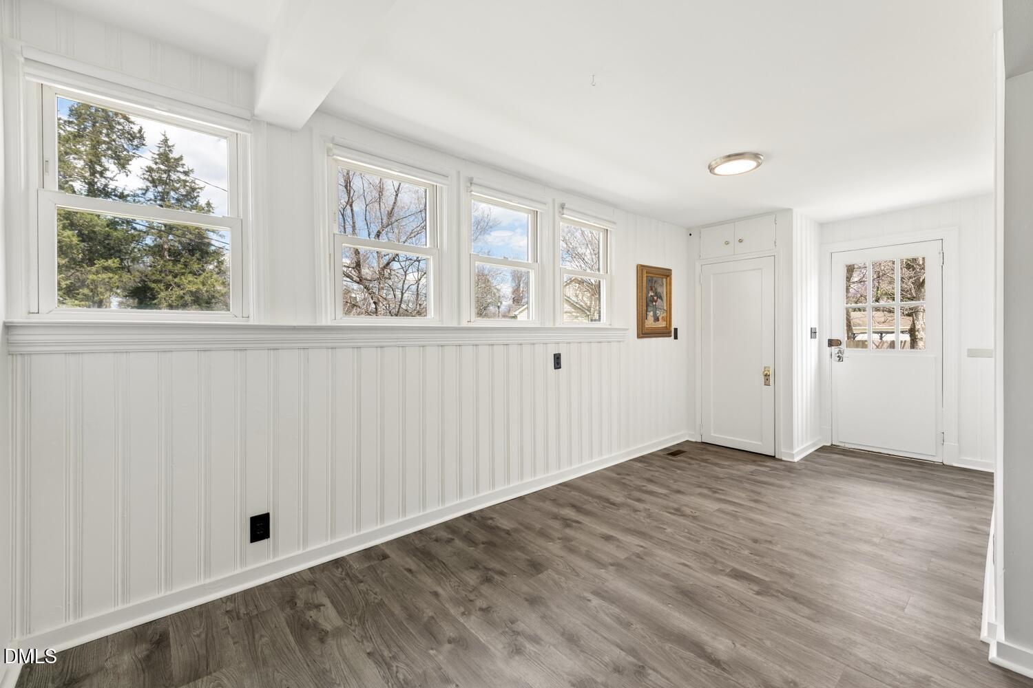414 South Maple Street Graham, NC 27253 - Photo 11 of 42 an empty room with wooden floor and windows