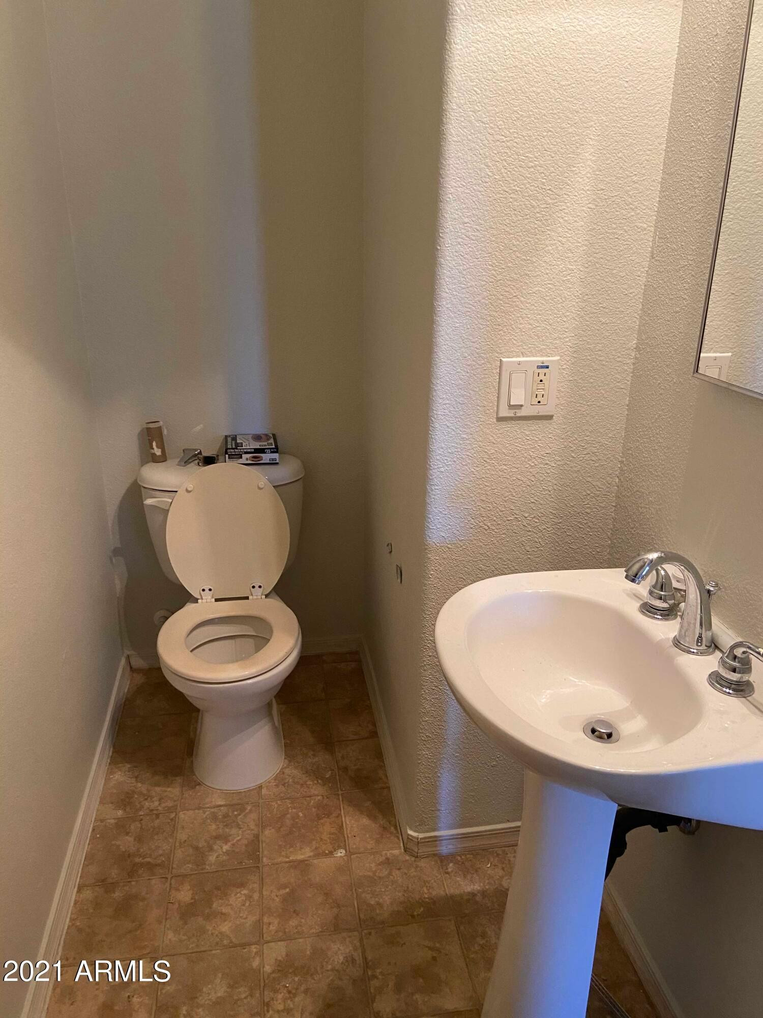 2929 North 37th Street, Unit 1 Phoenix, AZ 85018 - Photo 14 of 17 a bathroom with a sink a toilet and a mirror