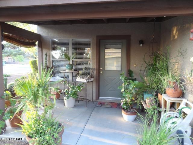 2929 North 37th Street, Unit 1 Phoenix, AZ 85018 - Photo 3 of 17 a potted plant sitting in front of a house