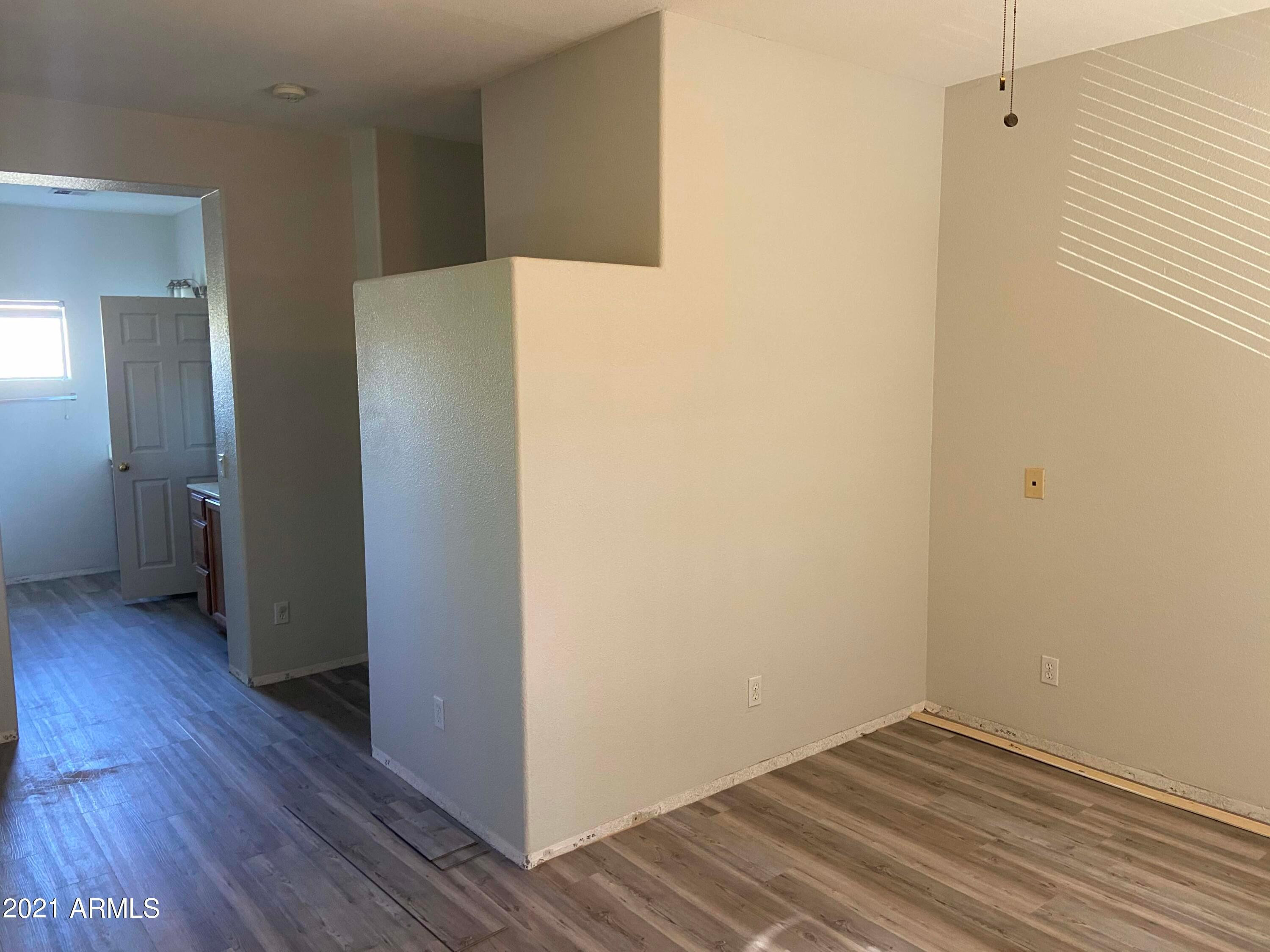2929 North 37th Street, Unit 1 Phoenix, AZ 85018 - Photo 8 of 17 a view of a hallway with wooden floor
