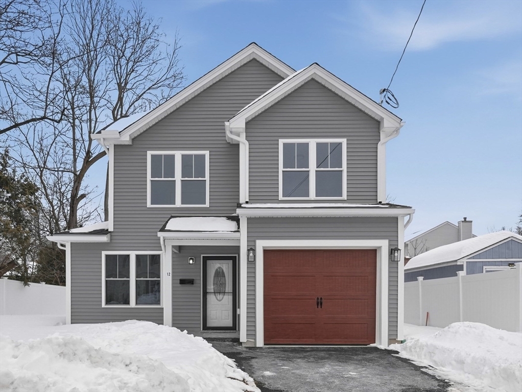 a front view of a house with a garage