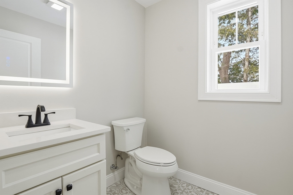 12 Benham Street Worcester, MA 01604 - Photo 12 of 26 a bathroom with a sink a toilet and a window