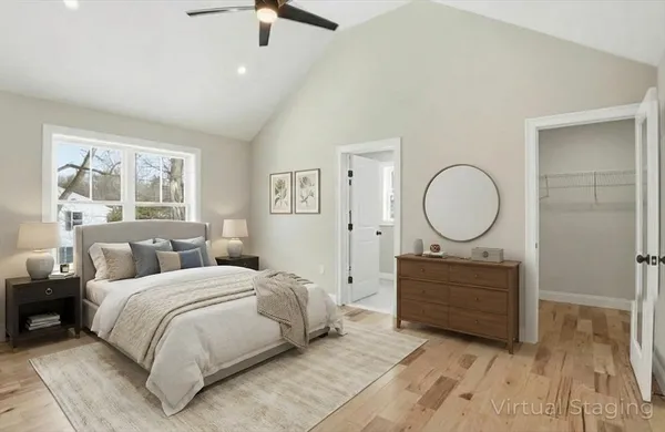 a bedroom with a bed and window