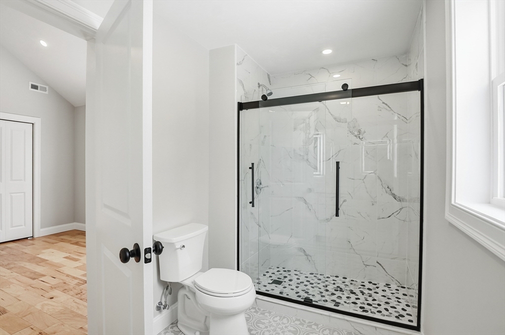 12 Benham Street Worcester, MA 01604 - Photo 18 of 26 a bathroom with a shower toilet and sink