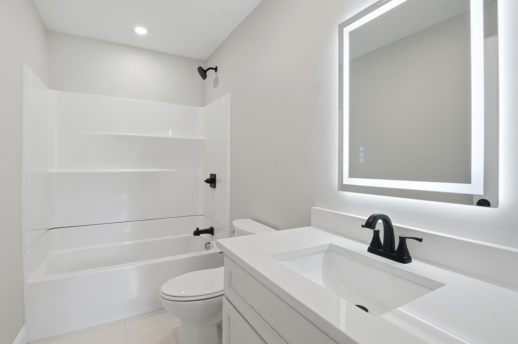 12 Benham Street Worcester, MA 01604 - Photo 20 of 26 a bathroom with a sink a toilet and shower