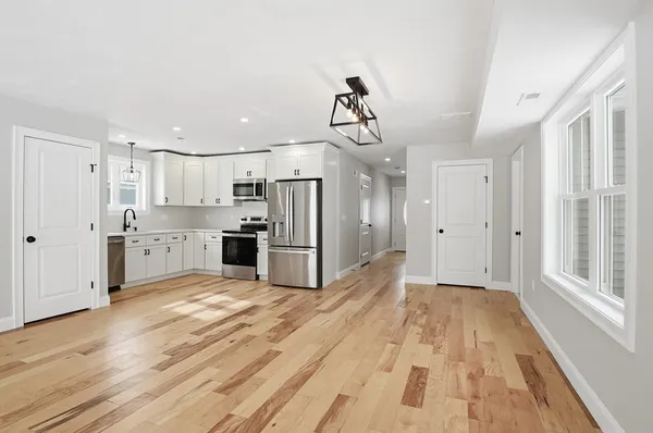a view of a kitchen with electric appliances